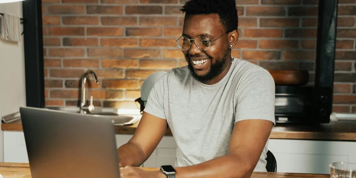 A man using a laptop.