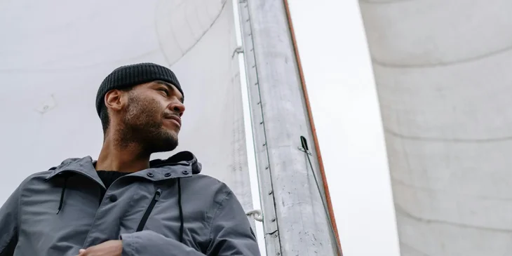 A maritime professional working on a sailboat.