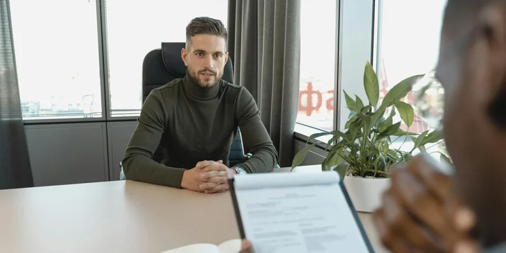 An HR representative interviewing a candidate for the open position.
