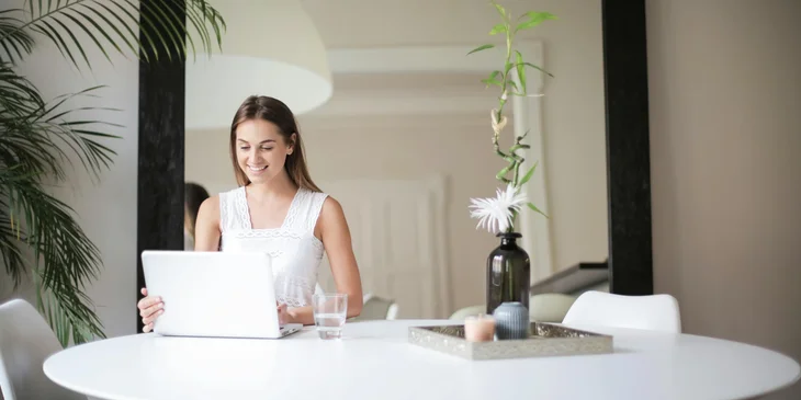A woman working remotely.