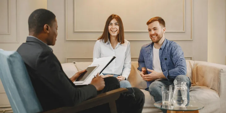 A social science research assistant interviewing research participants.