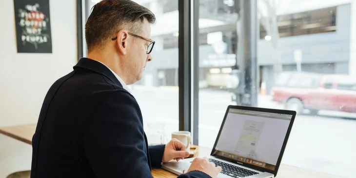 A person using a computer with sourcing tools.