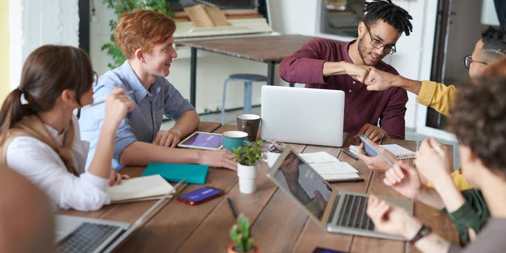 An entrepreneur and his team having a meeting.