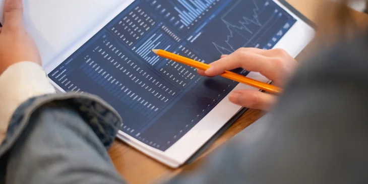 A statistician analyzing sales figures based on the findings in a report.