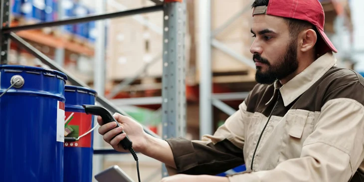 A stock associate scanning the items for product inventory.