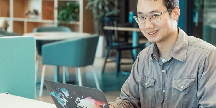 A tech employee typing on a computer.