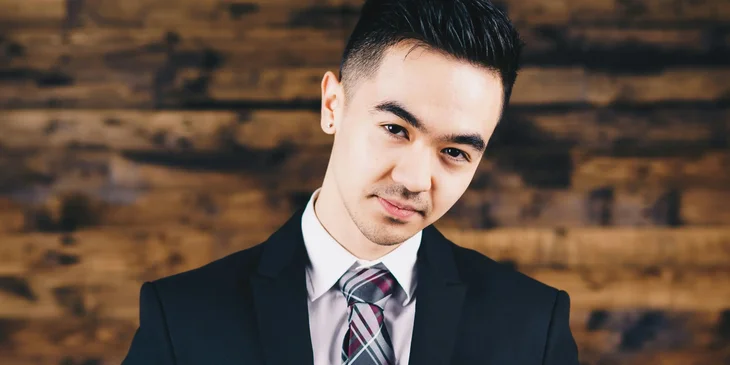 A man wearing a black blazer.