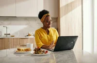 A woman reading the email after sending her application.