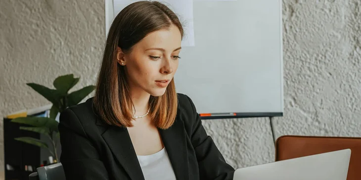 A woman working inside an office.