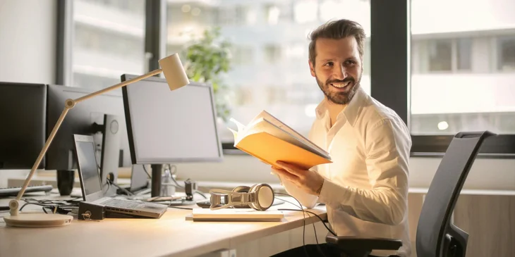A man holding a book.