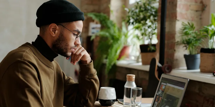 A man working on his laptop.