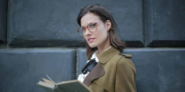 A woman holding a book.