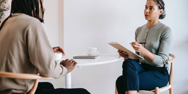 An interviewer and interviewee in one of the stages of a topgrading interview.