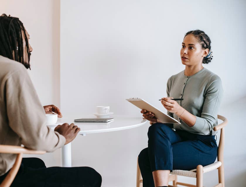 An interviewer and interviewee in one of the stages of a topgrading interview.