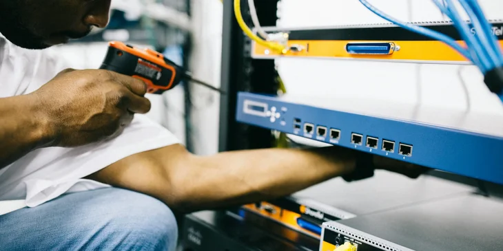 A variable frequency drive field technician working on-site.