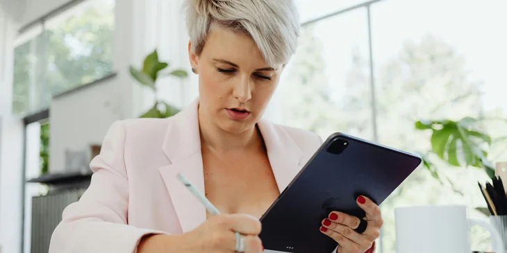 A woman working at her desk.