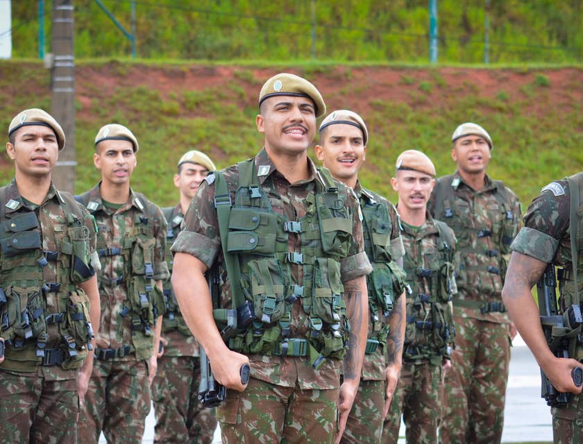 Veterans standing at attention during a parade.