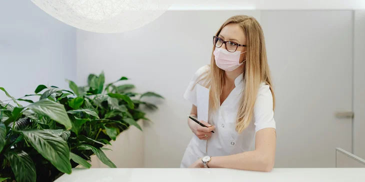 A veterinary office manager calls for the next patient.