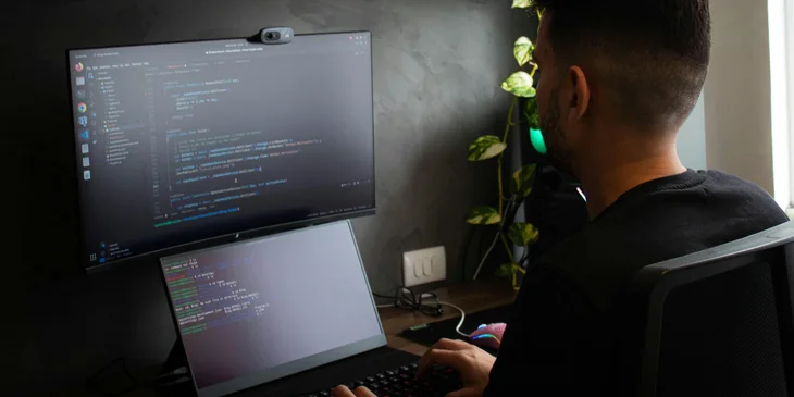 A VMware engineer works on his laptop.