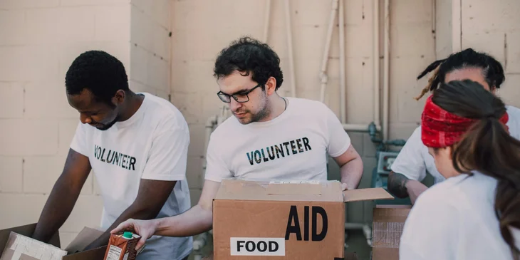 A group of volunteers handing out donations.