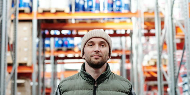 warehouse associate holding a tablet device