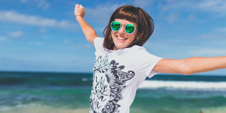 A happy person at the beach on a floating holiday.