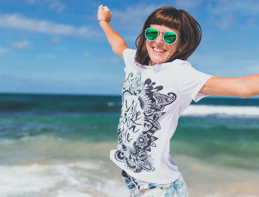 A happy person at the beach on a floating holiday.