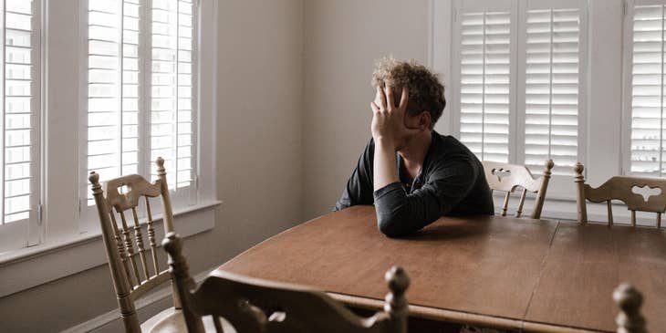 Man looking despondent after being laid off.