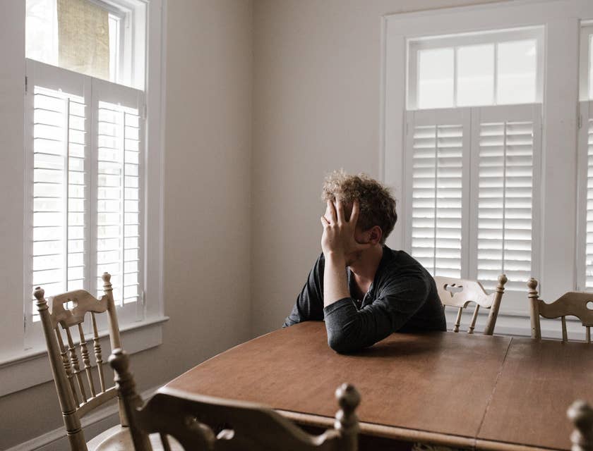 Man looking despondent after being laid off.