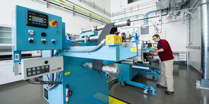 A machine operator working with a machine.