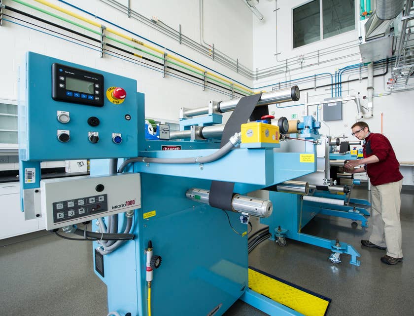 A machine operator working with a machine.