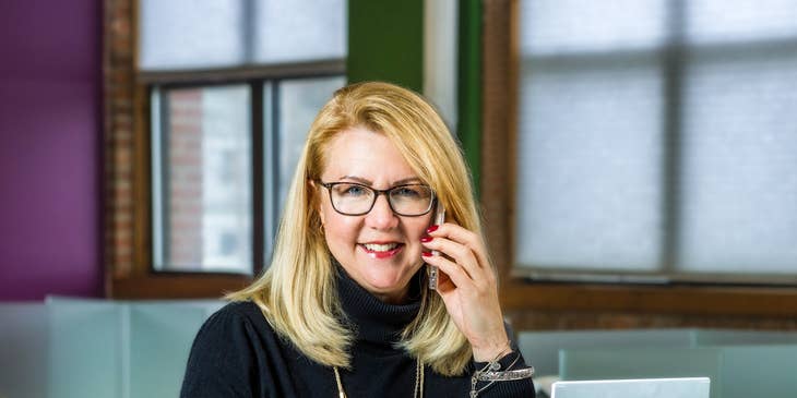 A woman with a white-collar job at work.