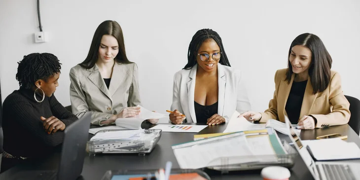 A group of women attending a meeting.