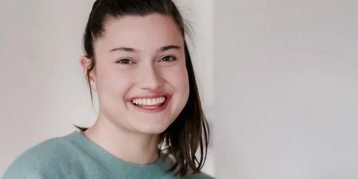 A woman smiling at the camera.
