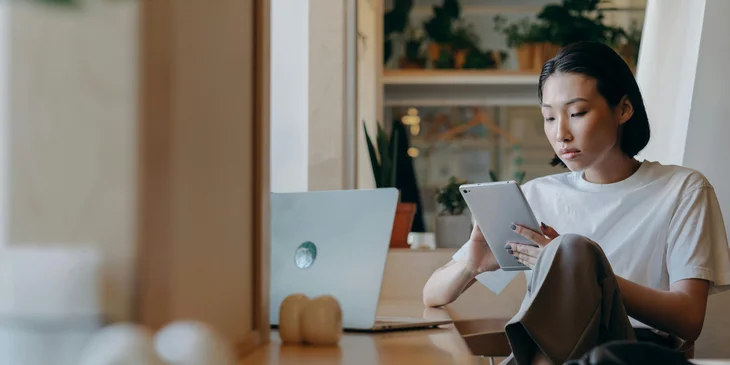 A woman using her tablet.