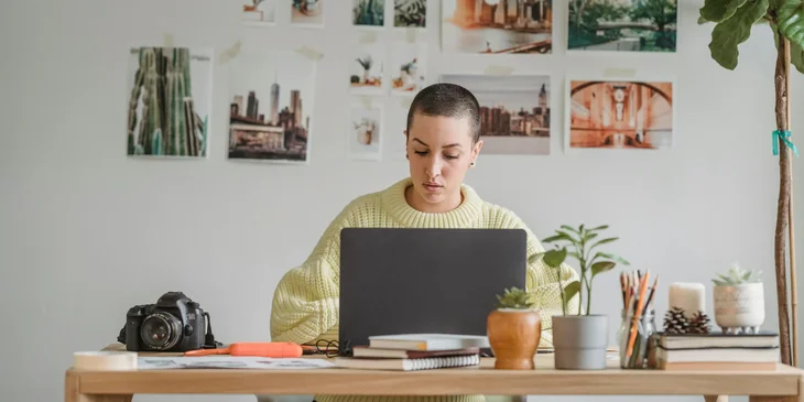 A woman working on her laptop.