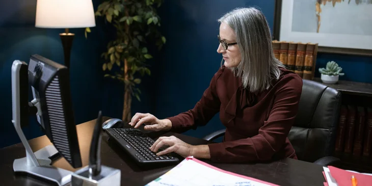 A woman working at her desk.
