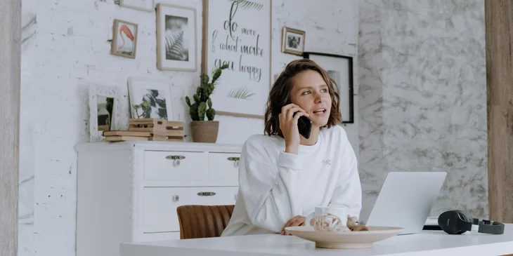 A woman talking on the phone.