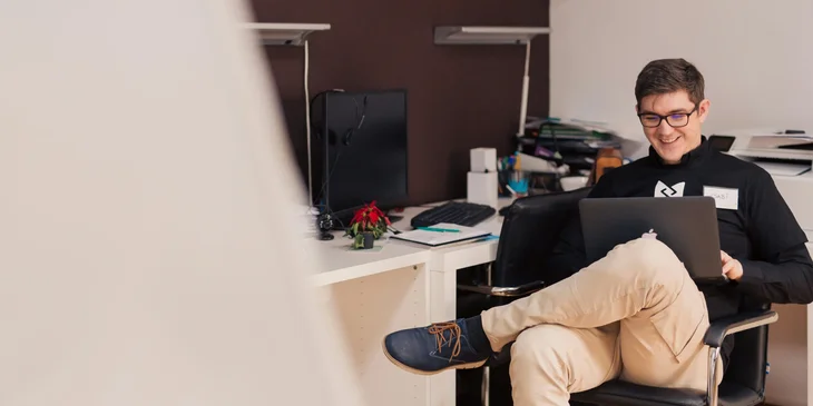 A man working on his laptop.