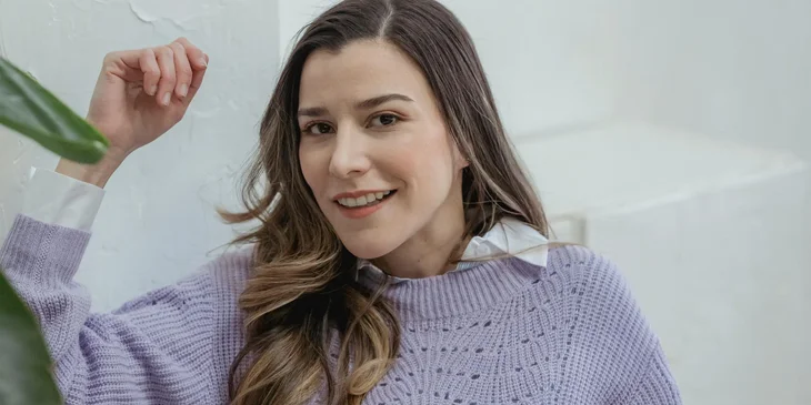 A young woman smiling.