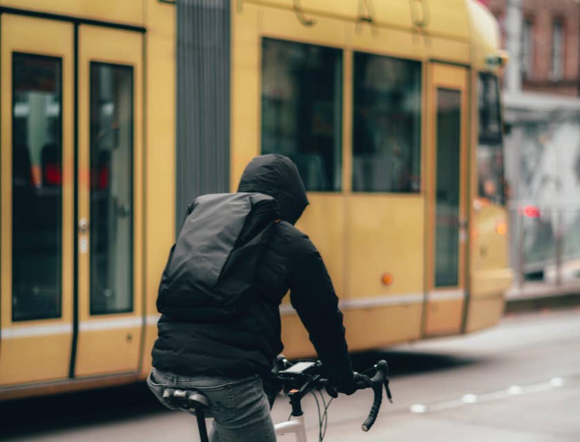 A Bike Courier riding a road bike about to deliver documents to a client.