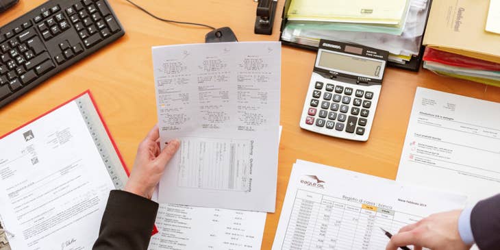 The billing specialist takes note of the payments made.