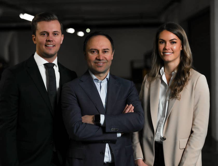 Board Members wearing business suits while standing and posing for the camera for a corporate shoot