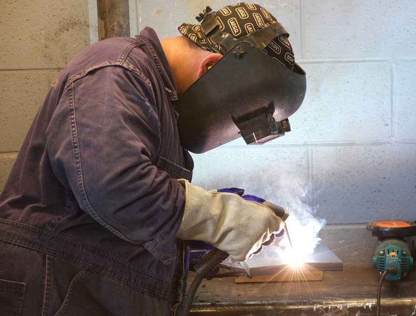 Boilermaker welding a part of the boiler