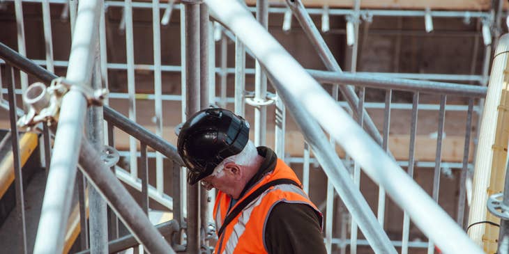 Building Inspector checks the safety of the building structure.