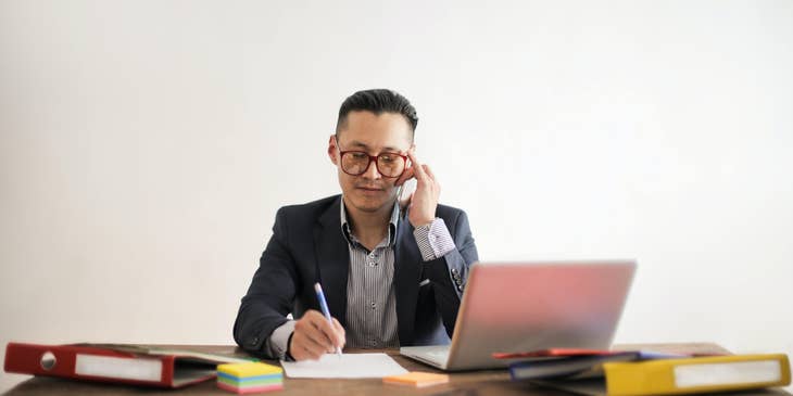 Business Development Manager on the phone with a client arranging a meeting