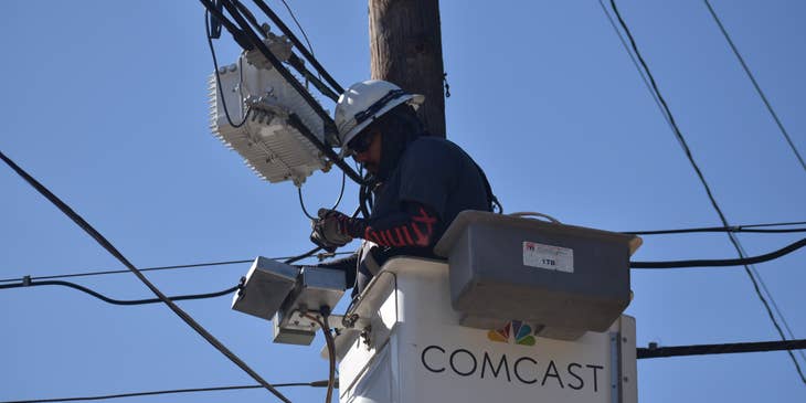 Cable Technician installing a line for a cable company