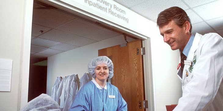 Cardiologist talking to patient outside the recovery room.