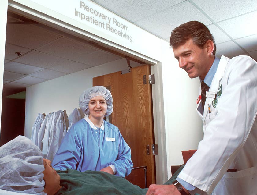 Cardiologist talking to patient outside the recovery room.