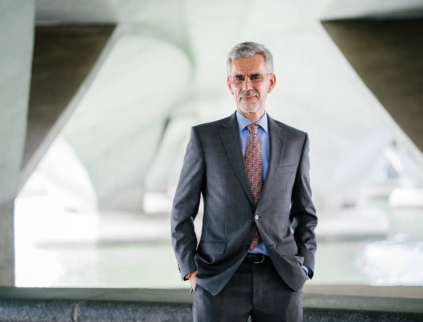 CEO posing for the camera outside his office for his corporate profile